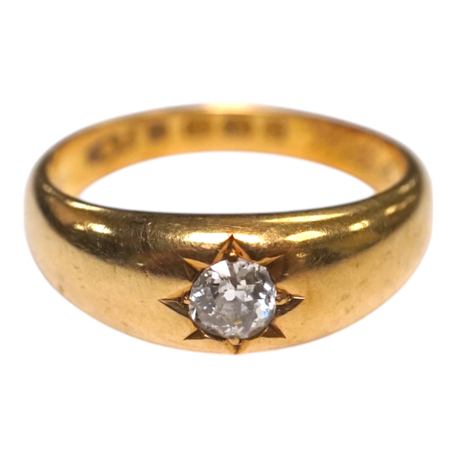 A late Victorian 18ct gold and gypsy set solitaire diamond ring, size Q/R, gross weight 7.7 grams. Condition - fair to good